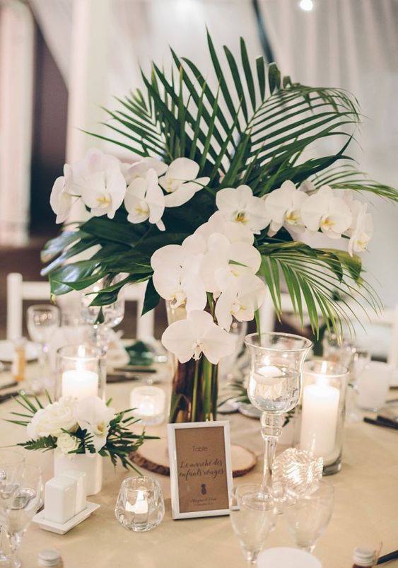 palm leaves and white orchids are a classic and chic combo for any wedding