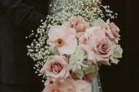 a gorgeous cascading wedding bouquet with blush roses and orchids, white roses and baby’s breath is a beautiful idea to rock