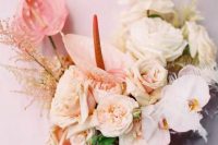 a neutral wedding bouquet of blush roses and carnations, orchids and peonies and anthurium and grasses