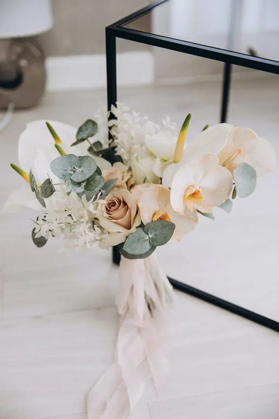 a neutral wedding bouquet of orchids, roses, anthurium, grasses and eucalyptus is a cool idea for a neutral wedding