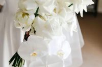 a sophisticated white rose and orchid wedding bouquet is a gorgeous idea for a modern or minimalist bride
