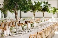 tall greenery centerpieces and matching greenery runners for a fresh and elegant spring look