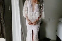 02 Chelsea was rocking a glam boho gown with lace appliques, a plunging neckline, a front slit and long fringe on the bell sleeves