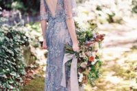 02 a blue lace embroidered and embellished wedding dress with bell sleeves and an open back