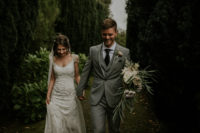 The groom was wearing a three-piece grey suit with a dark printed tie