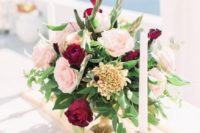 04 a gorgeous blush and burgundy wedding centerpieces with candles for a chic look