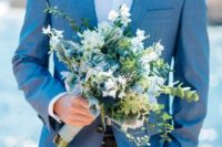 04 a light blue suit, a white shirt and no tie for a relaxed coastal groom look
