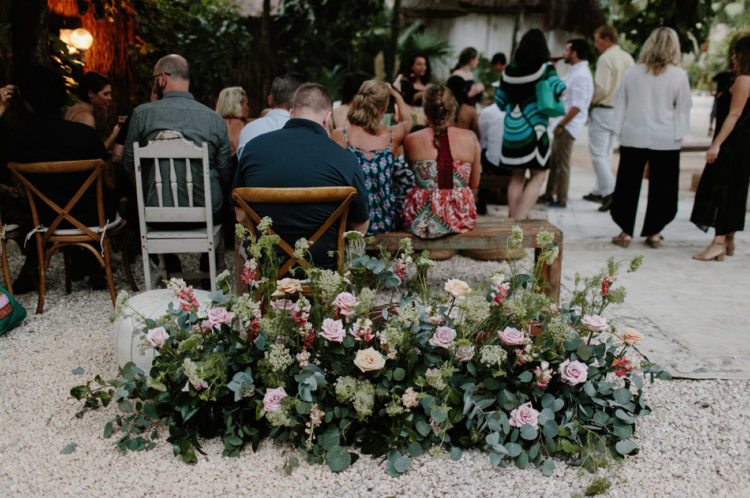 Lush florals with pink roses and much greenery were created for every space of the wedding