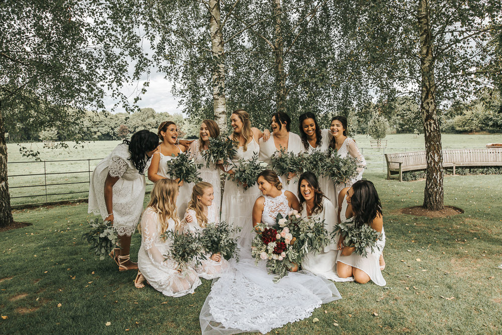 The bridesmaids were rocking mismatching lace dresses, white bridal parties are very popular