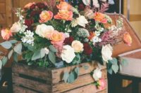 05 a crate stack with lush florals and greenery to decorate your wedding ceremony space