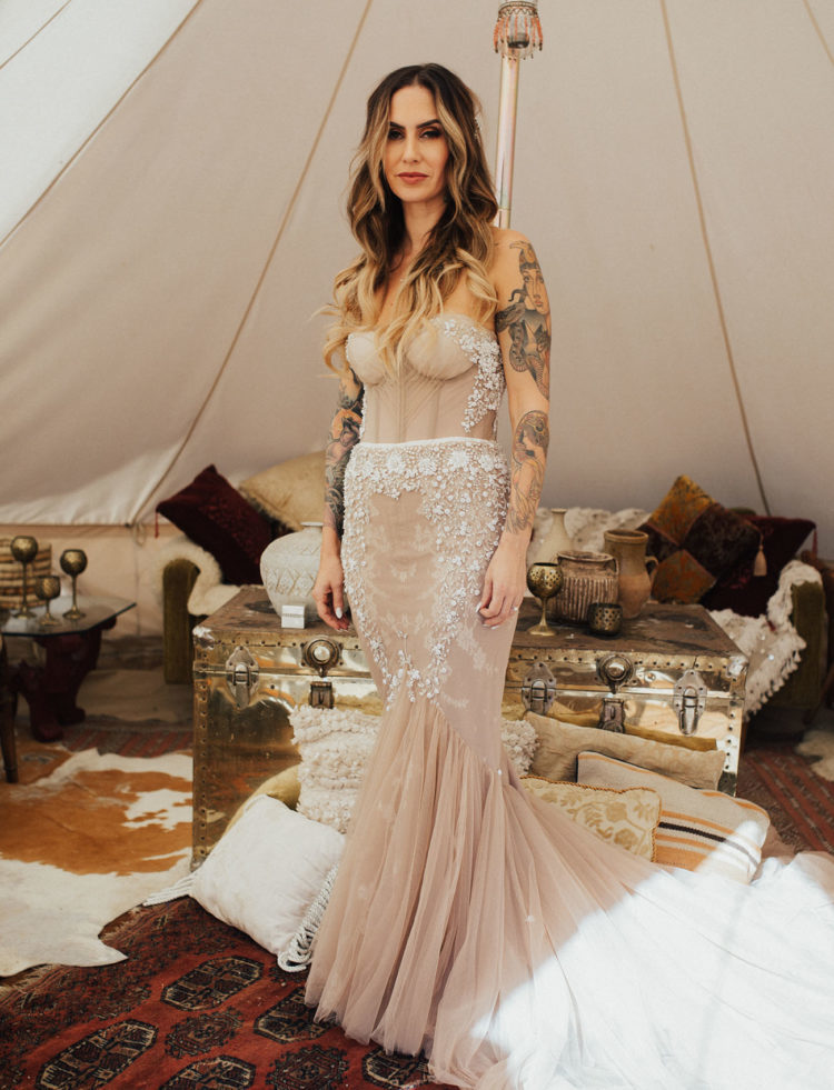 a gorgeouss blush mermaid wedding dress with rhinestones and beading for a wow effect
