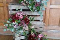 06 a crate stack with bright blooms and greenery arrangements will be a nice decoration for a rustic wedding
