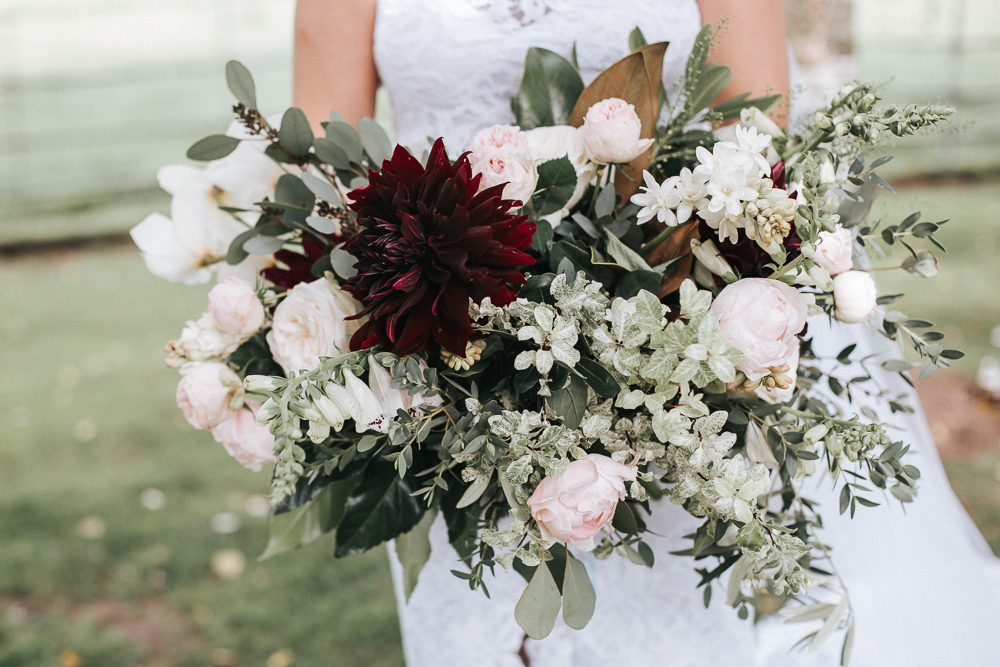 The wedding bouquet was done with pink peonies, dahlias and much greenery