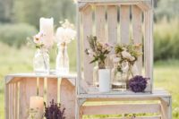 09 a crate decoration with candles, blooms in jars and vases for an outdoor rustic wedding