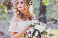 09 a lush floral crown with pink and white blooms and much greenery plus a matching bouquet for a summer bride