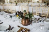 10 The centerpieces were done with copper vases and pots for a beautiful vintage look