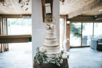 The wedding cake was a naked one, with fresh blooms and a calligraphy topper