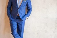10 a bold blue suit, a white shirt, a light blue tie and brown leather shoes and a belt for a summer groom