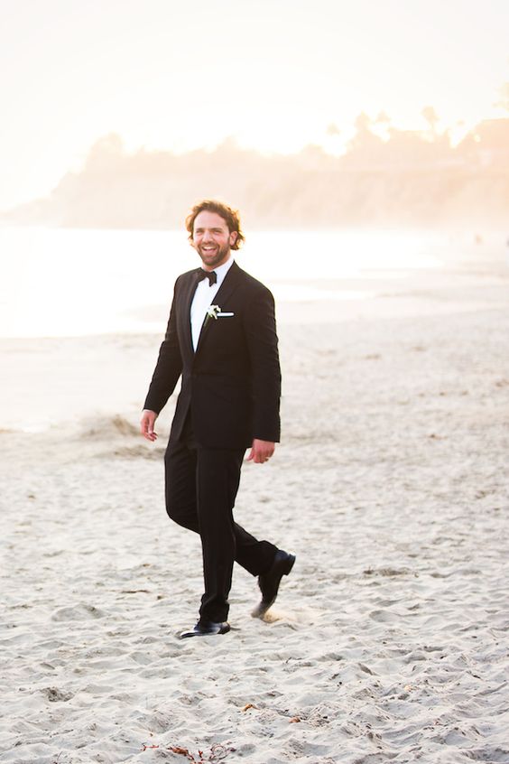 a classic black tux is always a way to go, even on the beach