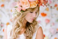 11 a large romantic floral crown of blush, orange and pink blooms plus some baby’s breath