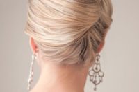 11 a vintage-inspired twisted chignon hairstyle is a great idea for a picure-perfect look