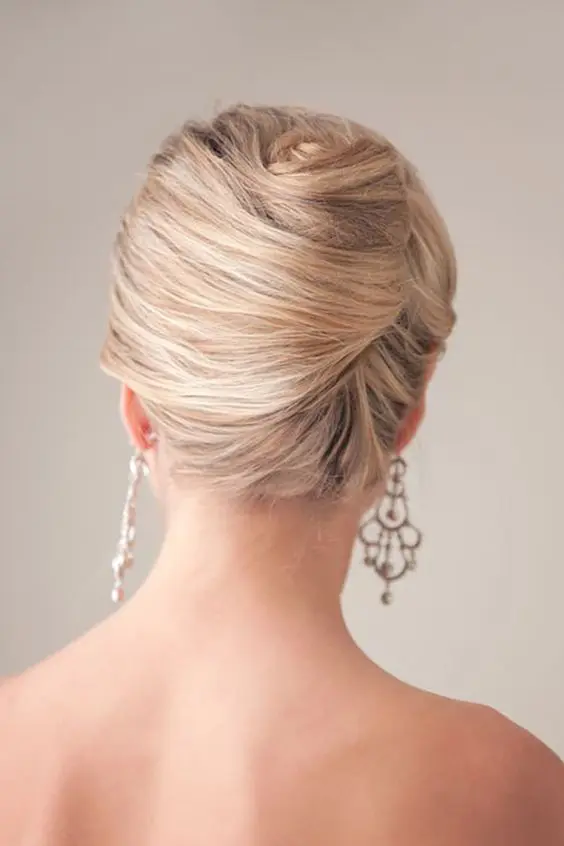 a vintage inspired twisted chignon hairstyle is a great idea for a picure perfect look