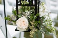 13 Borrby lantern is turned into a wedding aisle decoration with lush flowers and greenery