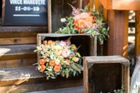 13 line up the wedding staircase with crates and bright and blush blooms and greenery inside