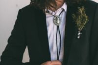 14 a black suit, a white shirt and a bolo tie for an effortlessly chic boho groom’s look