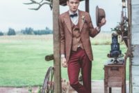 14 burgundy pants, a rust jacket and vest, plum-colored shoes and a brown hat for a vintage look