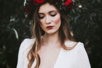 15 a large moody crown with red roses and dark greenery for a fall boho bridal look