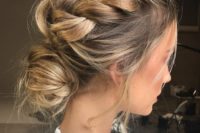 15 a messy braided updo with a low bun and locks down for a casual modenr bride