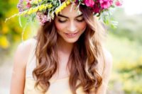 16 a large summer floral crown in hot pink and yellow with a texture for a summer bride