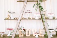 16 a wedding dessert table of a ladder and shelves decorated with lush greenery is a great DIY idea