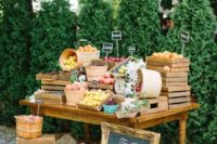 16 a wedding fruit table with crates with different fruits and cahlkboard tags for a rustic wedding