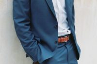 17 a blue grey suit with a sea foam bow tie, a brown belt and brown shoes for a coastal wedding