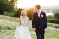 17 a gorgeous wedding dress with spaghetti straps and a heavily embellished bodice plus a flowy skirt