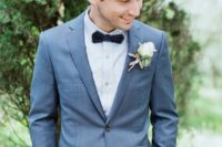 17 a grey wedding suit, a white shirt, a navy polka dot bow tie for an elegant feel