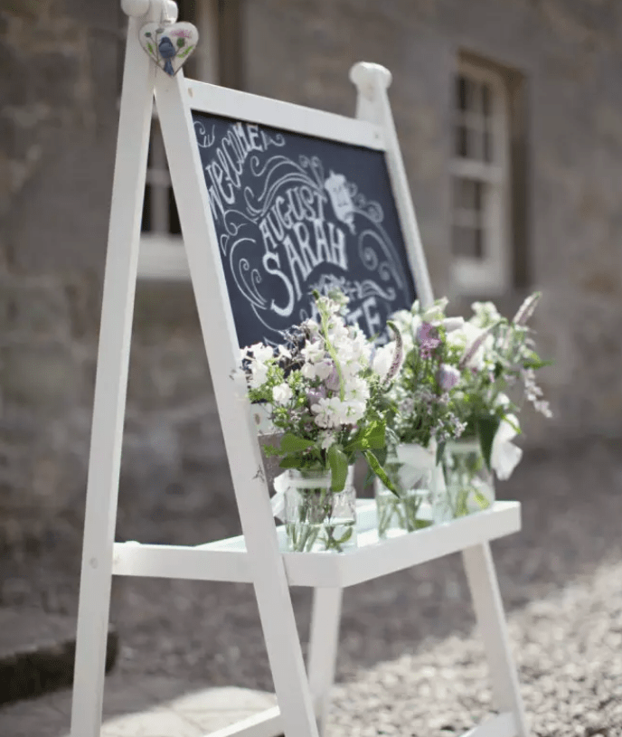 wedding signage with chalkboard and blooms using IKEA Mala easel for a dreamy touch
