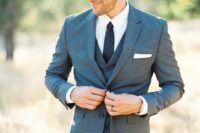 19 a grey three-piece wedding suit, a white shirt, a black tie is a modern look with a classic touch