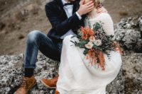 19 navy jeans, a black velvet jacket, brown shoes, a white shirt and a black bow tie for a textural groom look for a mountain elopement