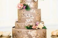 22 a taupe and gold wedding cake decorated with fresh blooms looks very sophisticated