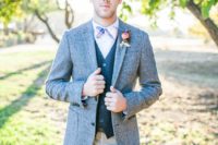 22 neutral pants, a dark grey vest, a light grey jacket and a colorful bow tie for a whimsy touch