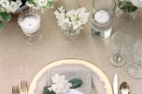 23 a chic neutral tablescape with taupe and gold plus white candles and blooms