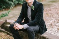 26 a rustic groom’s look with a grey shirt, a black velvet jacket, black pants and brown boots