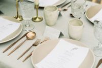 26 a taupe and grey table setting with cutlery and bright blooms for a fall wedding