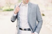 26 white pants and a shirt, a grey bow tie and a light grey jacket for a creative and fresh look
