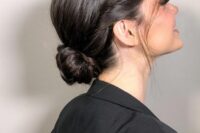 a beautiful and sleek low bun with twists surrounding the head and locks down is a lovely idea for a mother of the bride or groom