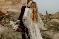 a breathttaking celestial A-line wedding dress with a cutout back, bell sleeves, a long train and silver scales all over the gown