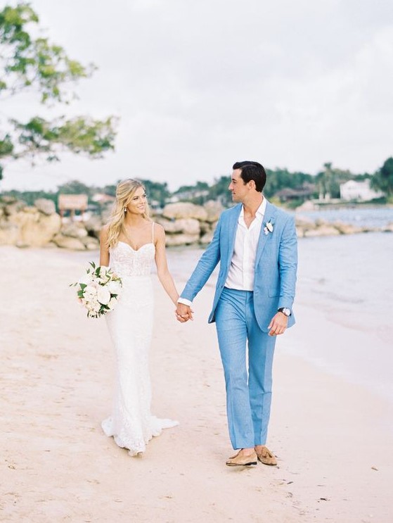 a bright blue groom's suit, tan moccasins and a white shirt for a bold and statement beach wedding look